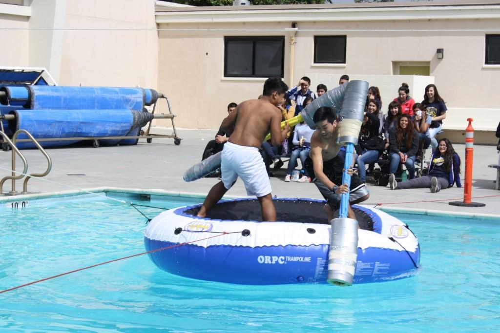 Two competitors battle it out in the pool during the Gladiator Battles on March 27.