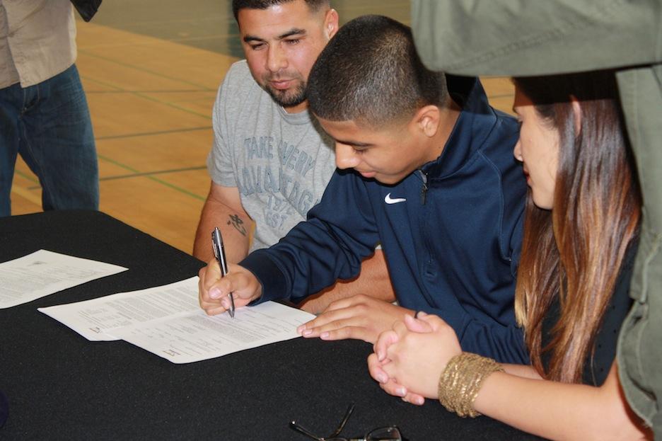 Jacob Muniz signs his letter of intent with Chaminade University of Honolulu