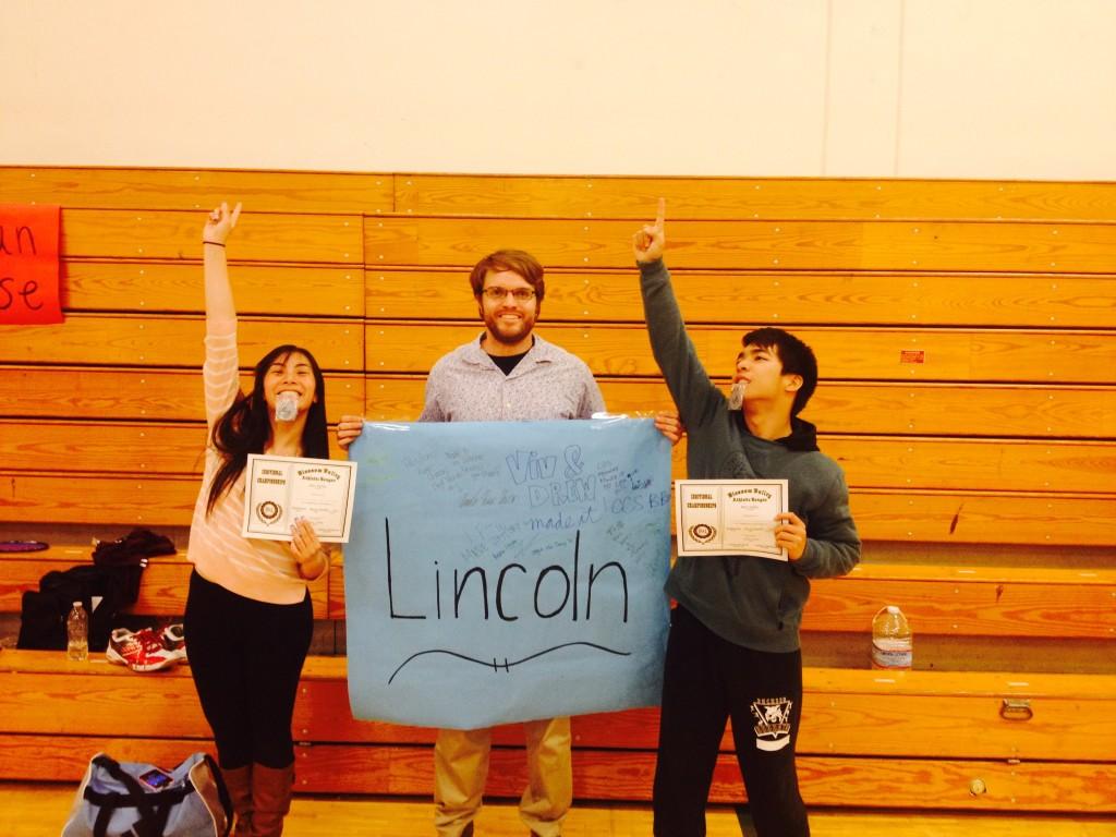 Vivian Le, Coach Alpers, and Andrew Nguyen celebrate their victory at league finals in Morgan Hill, CA.  They are the first mixed doubles pair in Lincoln history to win league finals and represent Lincoln in the CCS badminton tournament.