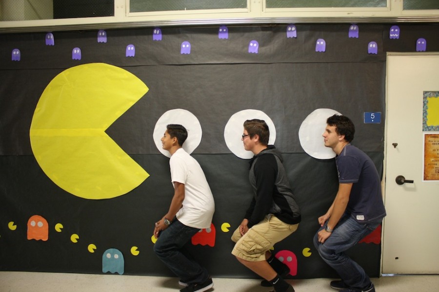First year Journalism students Javier Salazar, Jonathan Osuna and Nikola Zivkovic getting eaten by The Pacman.