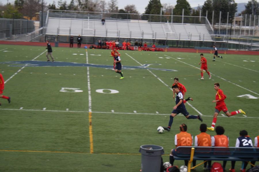 Junior, Gabriel De La Torre, getting ready to pass the ball to his teammate.