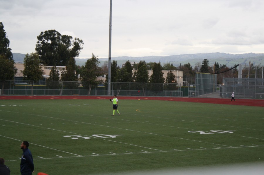 Goalie, Julian Lorenzo, communicating with his team from the opposite side of the field.