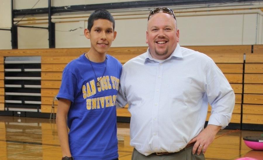 Mr. Hewitson and Jose Piña pose together after Jose had signed his scholarship. 