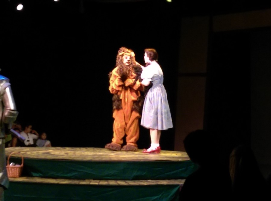 Dorothy tries to convince the Cowardly Lion that he does in fact have courage.