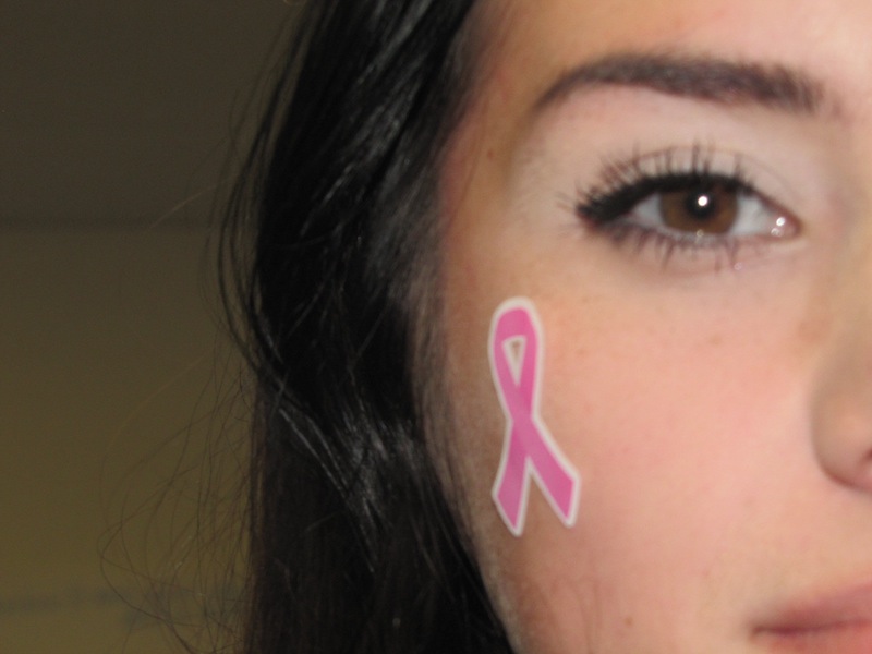Melissa Blasquez promotes Breast Cancer Awareness by wearing a pink ribbon sticker (Jacqueline Moncada/ Lincoln Lion Tales)