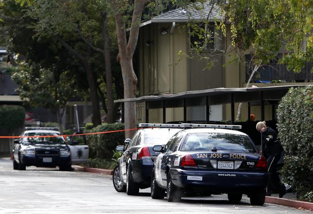 Police investigate the shooting of a 9-year-old boy who was hit by a bullet while sleeping in his bed Wednesday morning, Oct. 28, 2015 at an Almaden Road apartment complex in San Jose, Calif.  Police say an upstairs neighbor shot himself in the foot with a rifle and the bullet went through the floor, hitting the child. (Karl Mondon/Bay Area News Group)