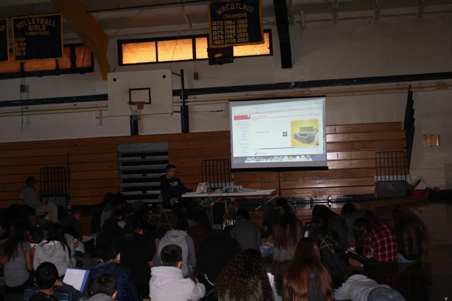 Freshmen siting in gym engaged to the presentation. (Kayla Aryanpour / Lincoln Lion Tales)