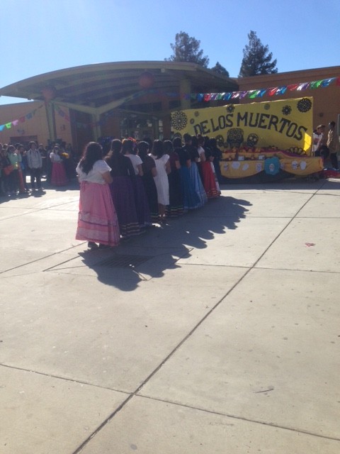 The Girls so their respect to their past love ones and bring gifts to the alter. The event happened  on Wednesday November 4, 2015. The Quad was transformed into a lively stage to celebrate Dia de Los Muertos. (L.Castillo/ Lincoln Lion Tales) 