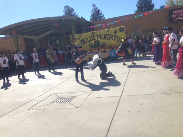 Manolo of The Book Of Life defeats the bull with his song. The event happened  on Wednesday November 4, 2015. The Quad was transformed into a lively stage to celebrate Dia de Los Muertos. (L.Castillo/ Lincoln Lion Tales) 