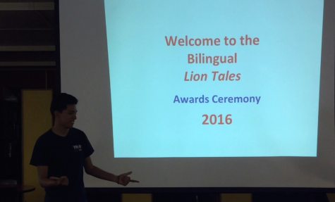 Hector Lopez translates, in Spanish, the awards ceremony. (Emalie Ortega / Lion Tales)