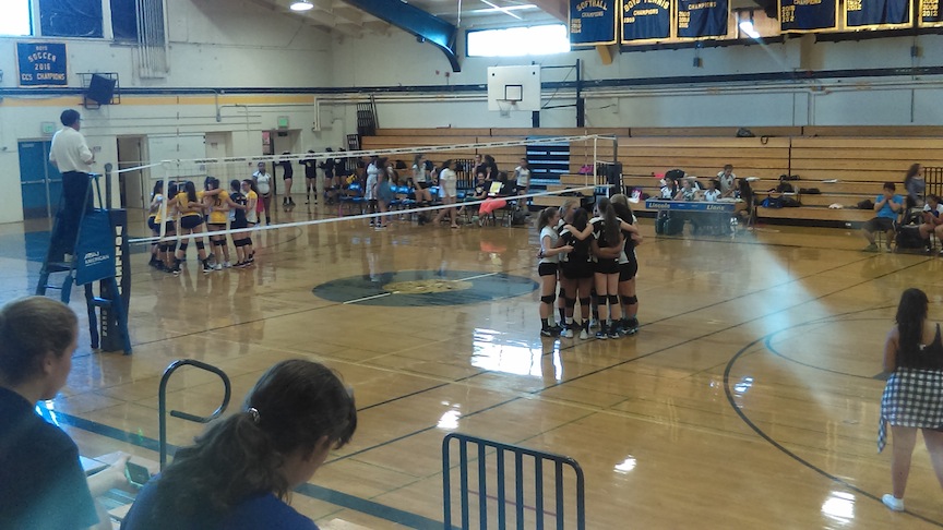 Girls volleyball huddling for their next play. (Lion Tales/Fernando Serna)