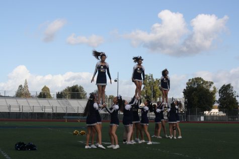 Lincoln cheerleading squad being lifted. (Alicia Gomez/ Lincoln Lion Tales)