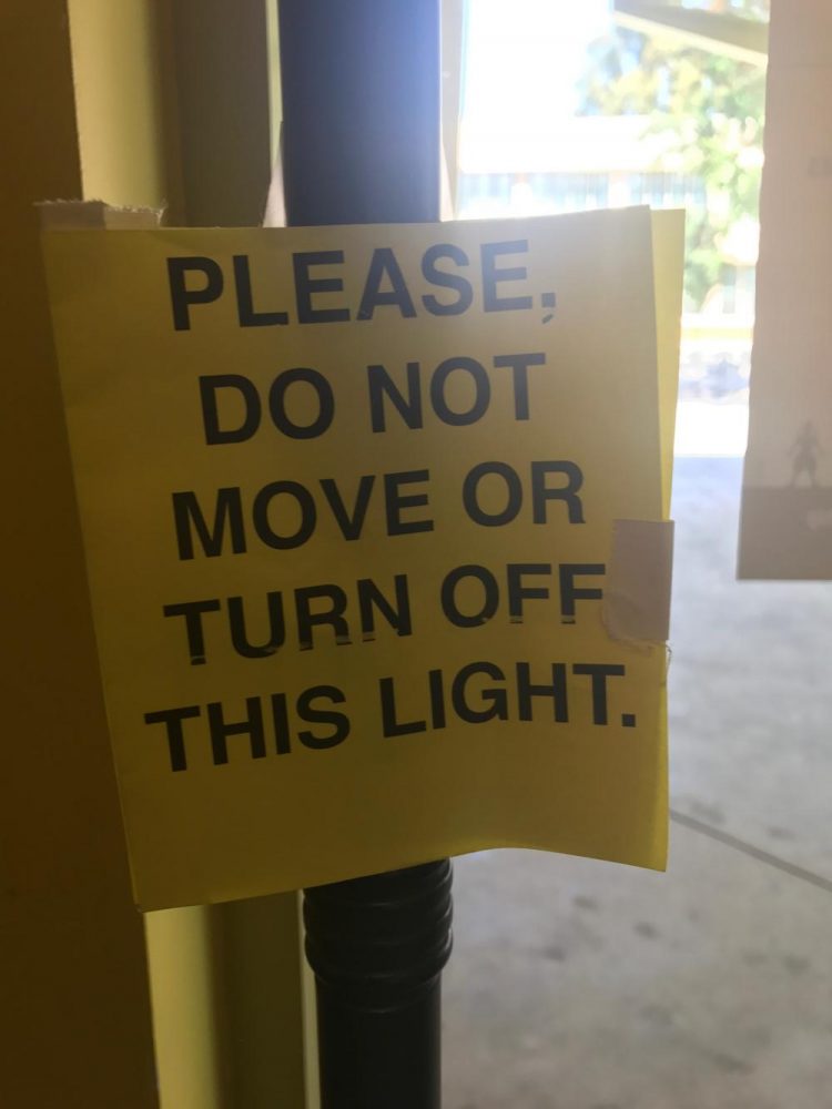A PLEASE DO NOT MOVE OR TURN OFF THIS LIGHT sign placed on The Ghost Light. (Fernando Serna/Lion Tales)