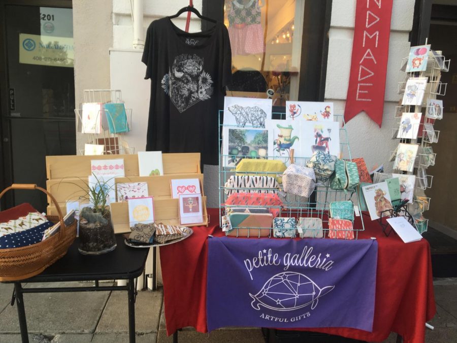 A small stand outside of Petite Galleria, owned by April Gee, featuring some of the select art that's sold at the shop.