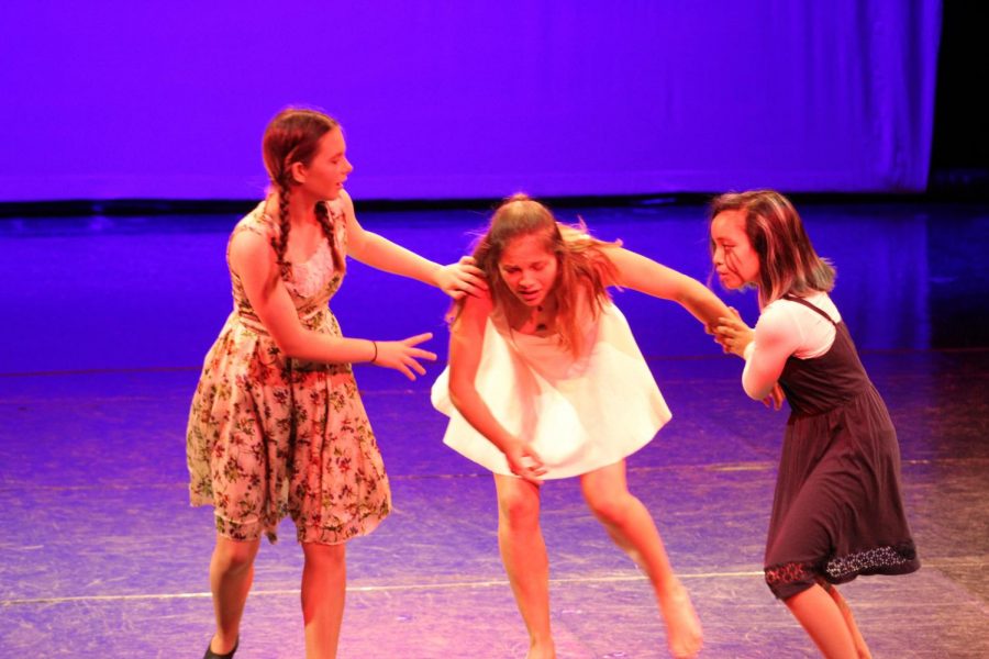  Emily Emmons, Ava Fein, and Mallory Malate (left to right) performing at Our Steps in October, 2018. (courtesy of The Monarch Yearbook)