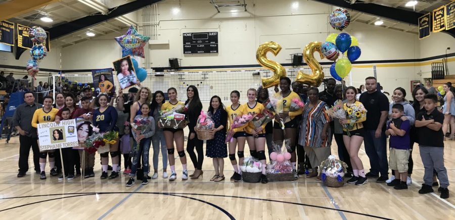 Left to right, Dani Najera, Stephanie Torres, Elva Mendoza, MIchelle Te, Stella Thomas, Asia Burns and Gemma Garcia pose with their families October 24, 2018. (Ariana Noble / Lion Tales)