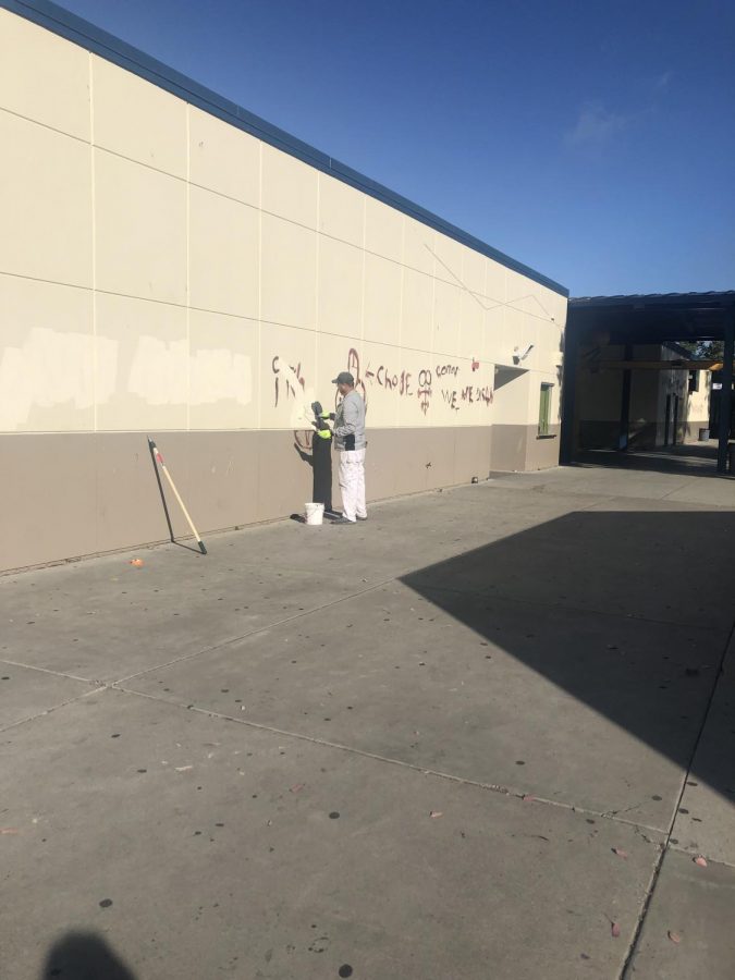 workers painting the wall to hide the crude messages and images on June 6th, 2019. (Nick Bernwanger Lincoln Lion Tales)